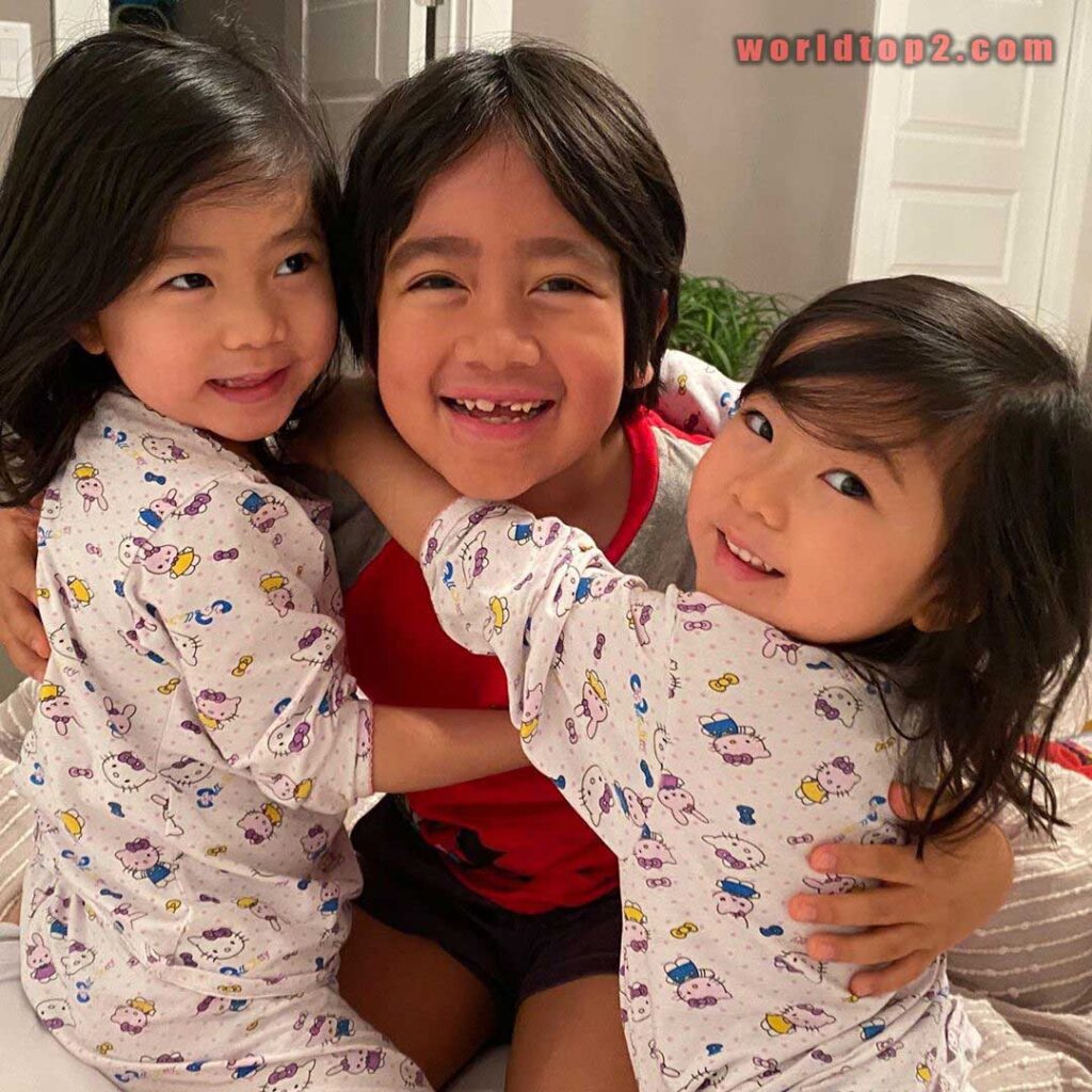 Ryan Kaji with his sister