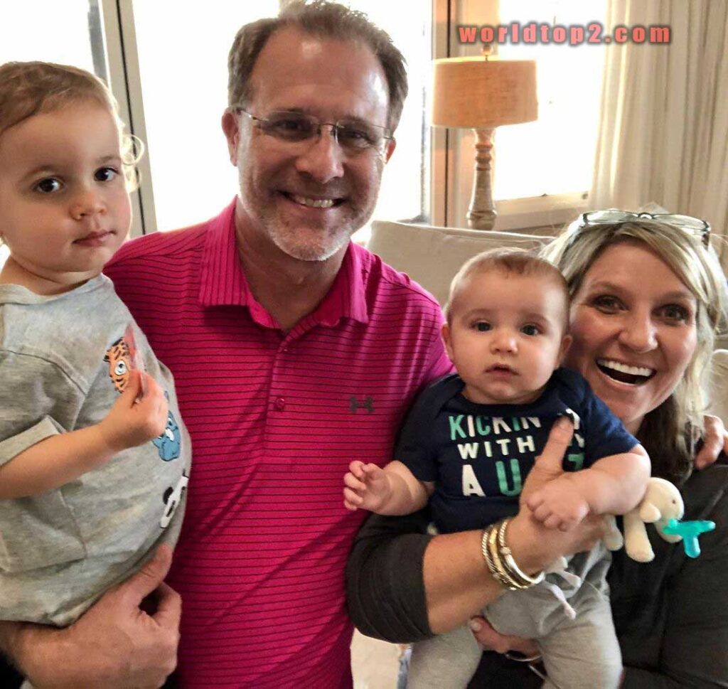 Gus Malzahn with his grand sons and wife