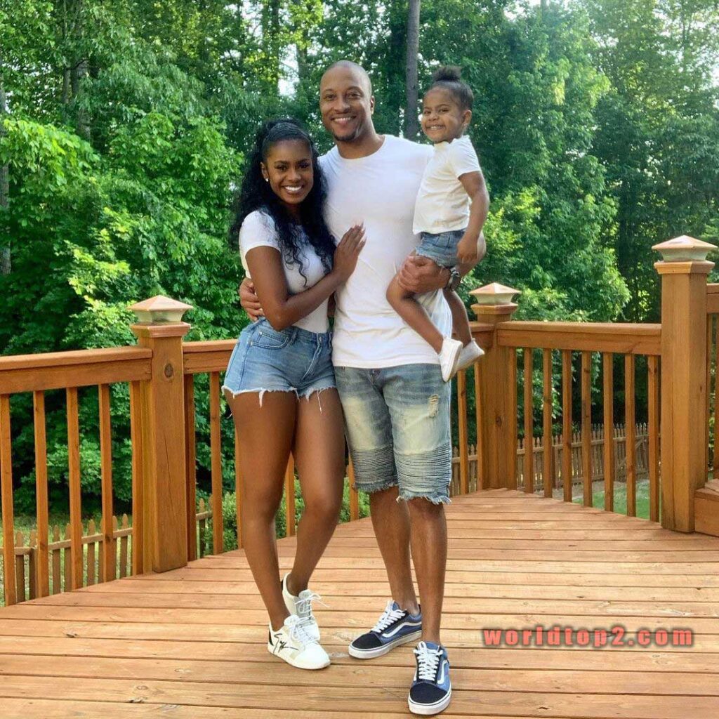 Kristen Scott with her husband and daughter