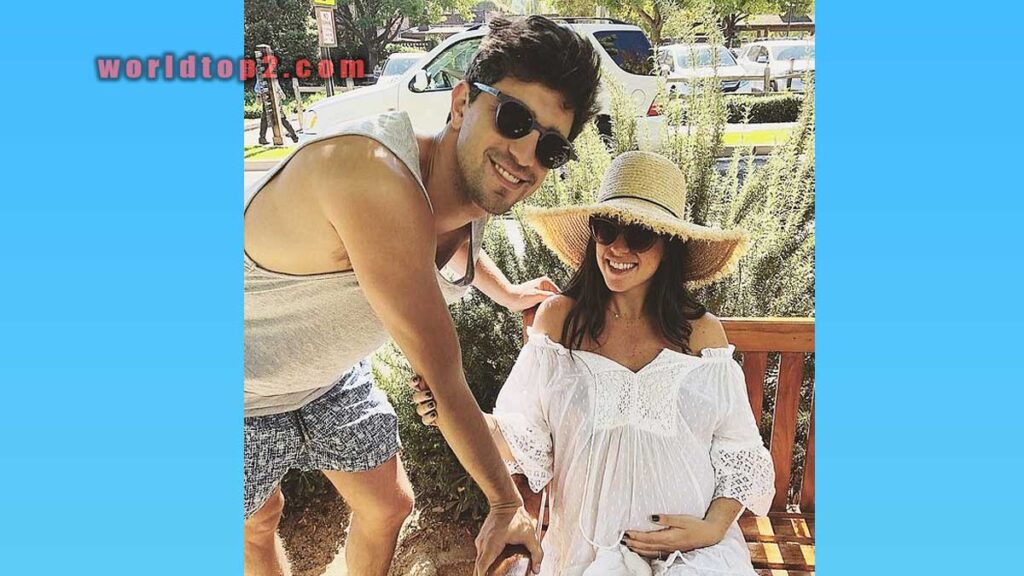 Nick Molnar with her pregnant wife before the birth of their daughter