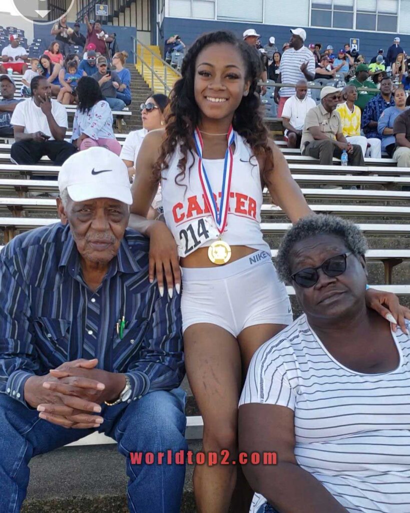 Sha'Carri Richardson with her grandfather and grandmother