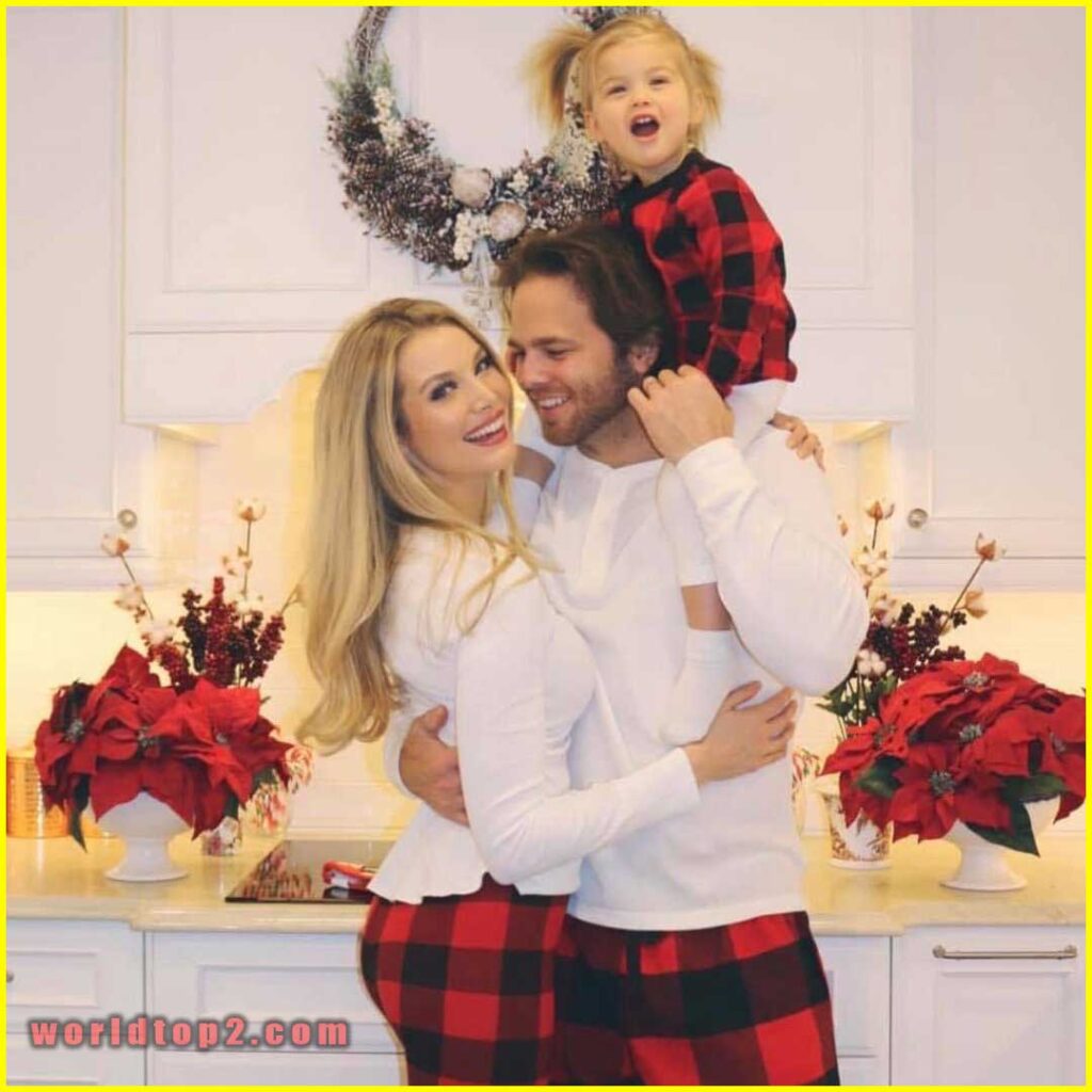 Emily Maddison with her husband and daughter