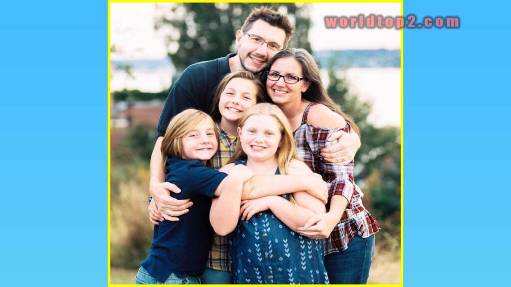 Joel Telling with his children and wife