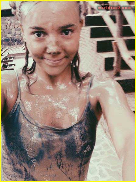 Synnøve Karlsen playing in mud