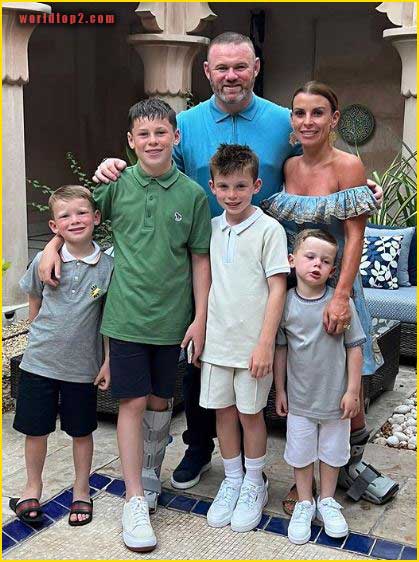 Wayne Rooney with his wife and sons